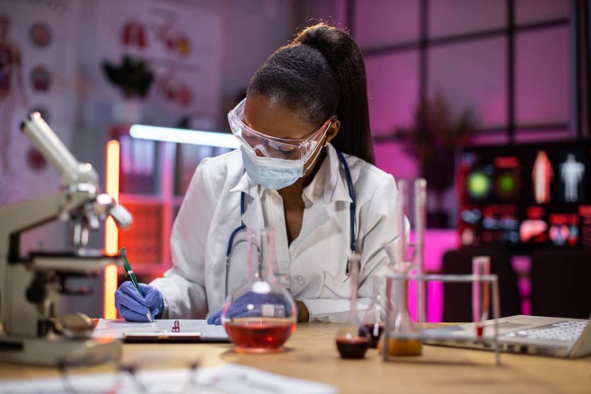 woman-microbiologist-or-medical-worker-writing-res-2023-11-27-05-06-21-utc